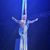A performer is suspended in mid-air, wrapped in aerial silks against a starry backdrop, exuding an aura of triumph and grace.