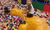 Kid Playing in the Ball Pit