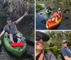 Two people are joyfully kayaking in a calm waterway surrounded by lush greenery