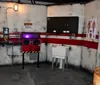 The image depicts an industrial-themed room designed to resemble a laboratory or hazardous area complete with warning signs a safety tape barrier a sink and a red machine or console