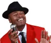The image features a person in a red suit with a black hat singing into a vintage microphone with the caption GRAMMY NOMINATED ARTIST and a Grammy award logo prominently displayed
