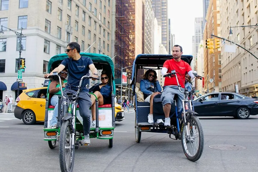 Pedal-powered rickshaws carry passengers through a bustling city street.