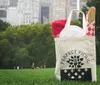 A bag labeled PERFECT PICNIC with a loaf of bread sticking out is prominently placed on a grassy field with people and city buildings in the background