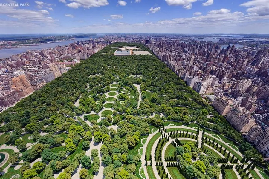 This image shows an aerial view of Central Park in New York City, surrounded by the dense urban landscape of skyscrapers and buildings.