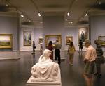 Tourists looking at art and sculpture Tourists looking at art and sculpture