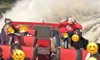 A group of people, with emoji faces obscuring their expressions, are enjoying a ride on a red speedboat with water splashing dramatically behind them.