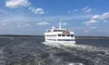 A white cruise ship labeled 