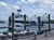 The image shows a docked boat with a sign reading