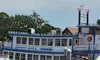 The image shows a riverboat named 