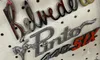 The image shows an arrangement of vintage car emblems, including 