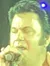 Elvis Impersonator on Stage
