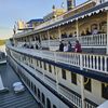 This image shows passengers aboard the multi-level decks of the