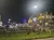 The image shows a themed restaurant or attraction at night, illuminated by lights, with