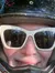 A group of people wearing protective helmets are ready for an ATV adventure in the woods, as seen in a selfie taken by one of the riders.