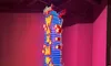 A tall, brightly lit neon sign reading