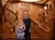 A couple is posing for a photo on a grand staircase replica inside the Titanic museum attraction.