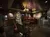 The image shows a cozy interior space decorated with a Christmas tree, warm lighting, sofas, a mural, and framed pictures, evoking a festive atmosphere.
