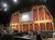 The image shows a stage set up with musical equipment in front of the backdrop with the Grand Ole Opry logo, indicating a performance venue.