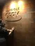 A person is touching a wall inscribed with names under the