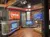 A modern and well-equipped radio broadcast studio with sleek design features and branded signage for WSM Studios and Springer Mountain Farms.