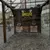 The image shows a rustic axe-throwing target area with a