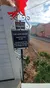 The image features a sign marking the Lotz House, constructed in 1858 and noted as the epicenter of the Battle of Franklin on November 30, 1864, with a red ribbon at the top, set against a background of a street and buildings under a cloudy sky.