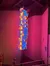The image shows a colorful neon sign for the