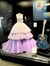 The image features a display case containing a lavender and purple tiered gown alongside a blue acoustic guitar, with an informational plaque about Taylor Swift.