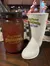 The image shows a mason jar and a boot-shaped cup, both labeled 