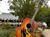 A couple stands in front of a large guitar statue outside the Grand Ole Opry.