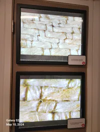 The image shows two framed close-up photographs of woven fabric, labeled as photomicrographs of the Shroud of Turin.