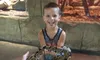 Young Boy with a Snake at RainForest Adventures Discovery Zoo