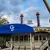 The image shows the General Jackson showboat with its distinctive blue canopy and signage, set against a backdrop of a cloudy sky.