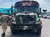 A camouflaged bus labeled 