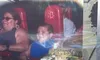Two people are seated on a thrill ride called 