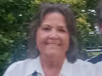 A couple is sitting in front of a 