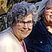 A group of people are posing in front of the 