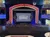 The image shows an ornate theater stage set up for 