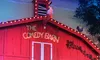 The image shows a stage set designed like a red barn with the sign 