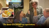 A group of people is enjoying a meal at a restaurant, receiving positive reviews for the food and experience, with a waiter giving a thumbs-up sign.