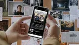 A person's hands are holding a smartphone displaying a podcast app with an episode titled Case Briefing in front of a bulletin board filled with various photos and notes, suggesting the theme of investigation or crime analysis.