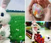 A person dressed in a large fluffy bunny costume is seated on a red childrens ride-on train in an indoor play area