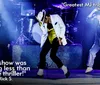 Three performers dressed in Michael Jackson-style outfits are on stage with quotes praising the performance as the greatest MJ tribute act and a true thriller