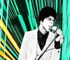 A man in a vintage suit passionately sings into a microphone against a backdrop of vibrant green and yellow geometric lines