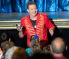The image is an advertisement for Bransons Best Dinner Show featuring The Magic of Taylor Reed known for a 3-course dinner and a performance seen on Americas Got Talent