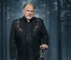 The image features a man in a decorated suit holding a guitar against a forest background with text saying Winter Wonderland Gene Watson Branson MO