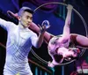 This image features promotional visuals for the New Shanghai Circus showcasing acrobats performing with text highlights including Spellbinding and Unlike anything youve seen before