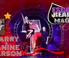 The image features a promotional poster for Escape Reality Magic Christmas with Garry  Janine Carson performing a magic act set against a festive red background