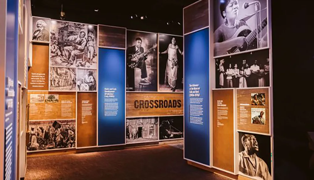 The image shows a museum exhibit titled CROSSROADS that features a series of panels with photographs and text chronicling the history and influence of music