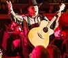 The image advertises a Nashville country music residency featuring live performances with a dinner and show package set in an energetic atmosphere